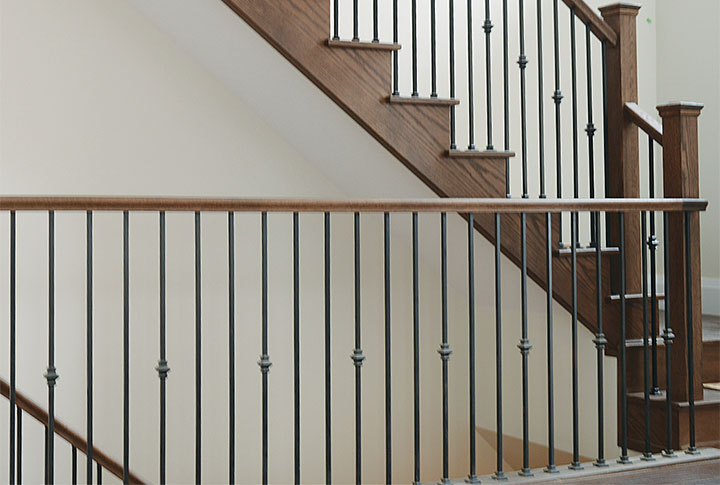 wrought iron spindles and oak railings